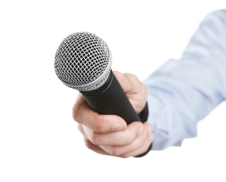 Male hand holding microphone for the interview