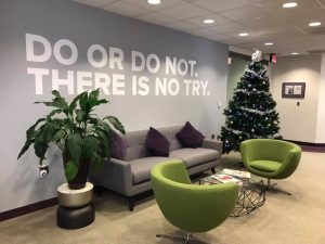 A picture of an office waiting area, with the words 'Do or do not" written above, and 'There is no try' written below.