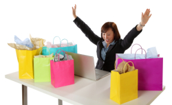 Woman shopping online surrounded by shopping bags
