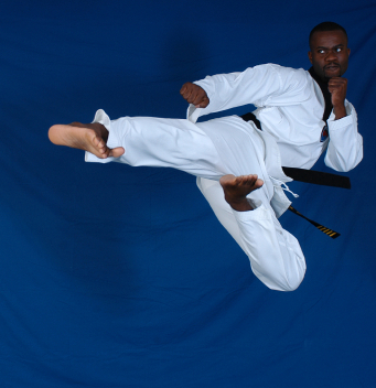 Image of martial artist doing a flying sidekick