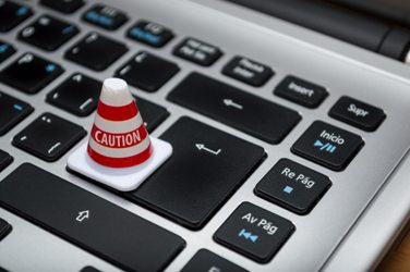 caution cone on computer