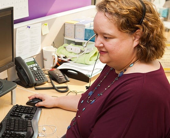 Janna, MatrixMaxx Client Success Manager, working at computer